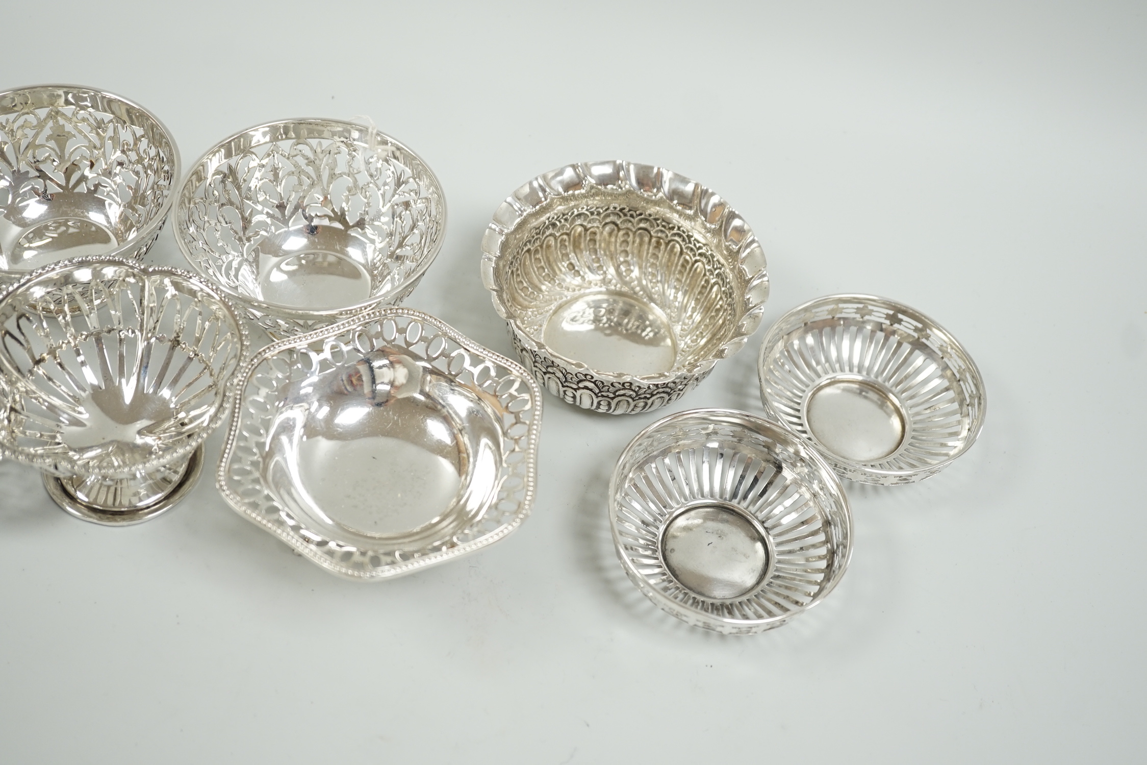 A modern pair of pierced silver sweetmeat bowls, by C.J. Vander Ltd, diameter 84mm, a pair of earlier bonbon dishes and four other silver bowls, 15.9oz.